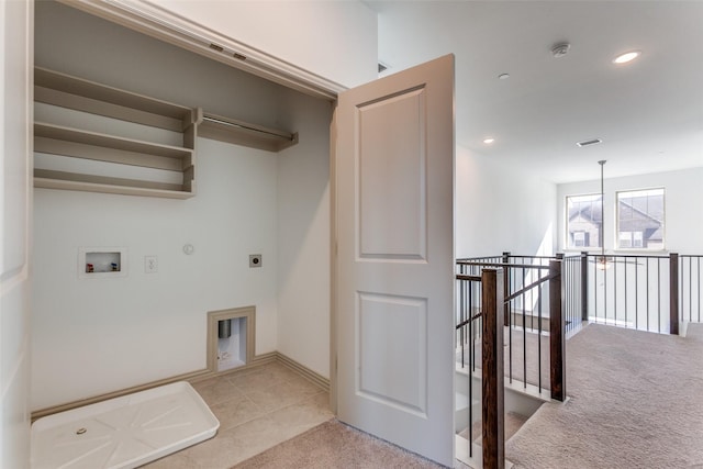 laundry area featuring hookup for a washing machine, electric dryer hookup, light colored carpet, and hookup for a gas dryer