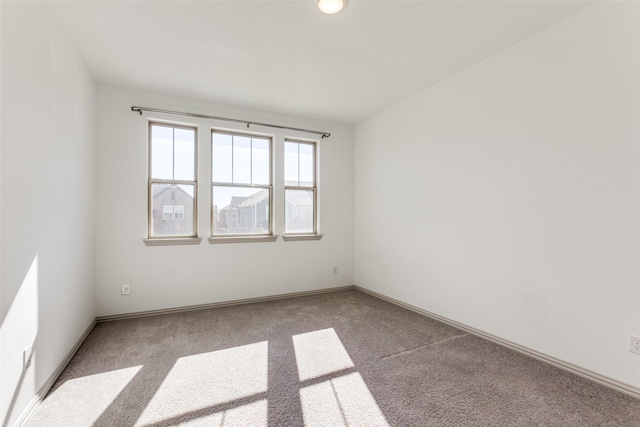 unfurnished room featuring carpet