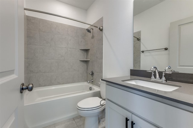 full bathroom with vanity, toilet, tiled shower / bath, and tile patterned flooring