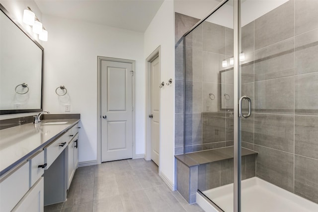 bathroom featuring an enclosed shower and vanity