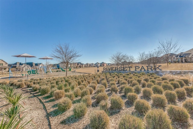 view of property's community with a playground