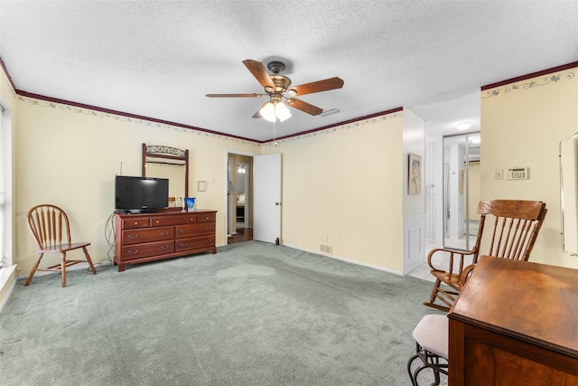 home office with light carpet, a textured ceiling, and ceiling fan