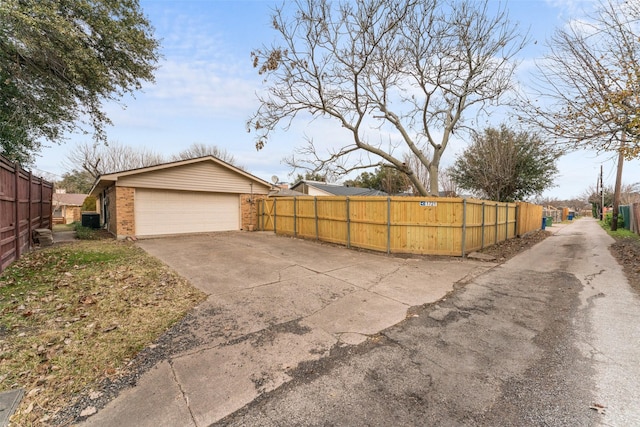 exterior space featuring a garage and central AC unit