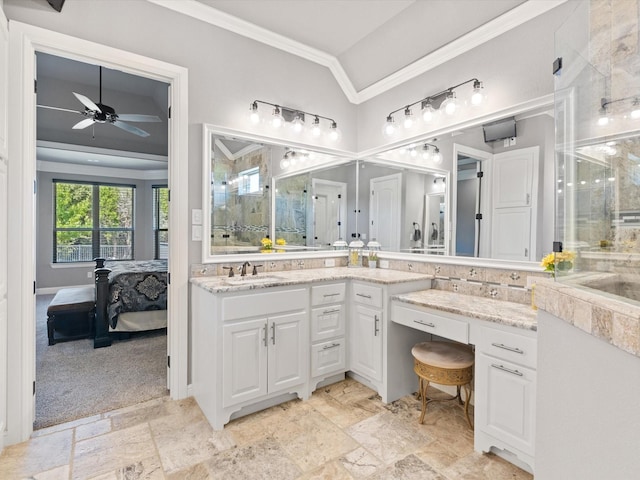 bathroom with ceiling fan, vanity, ornamental molding, and vaulted ceiling