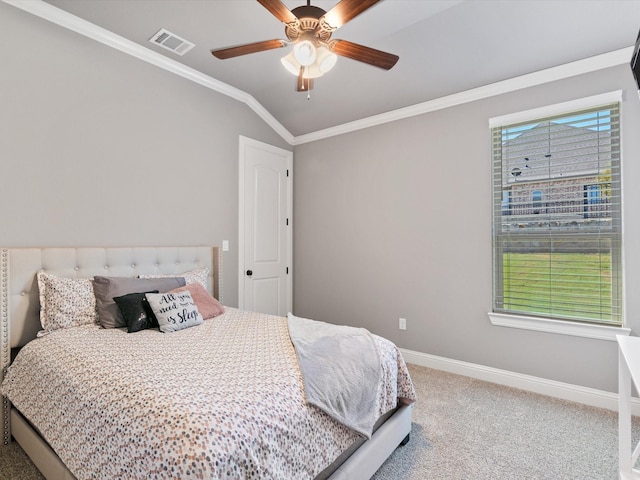 bedroom with carpet, vaulted ceiling, ceiling fan, and ornamental molding