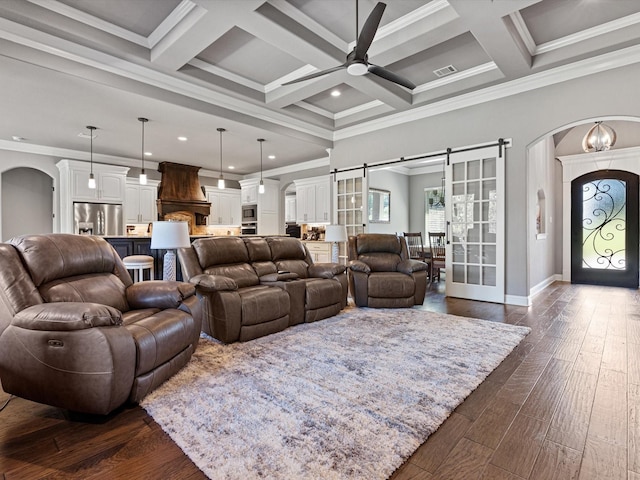 living room with beam ceiling, coffered ceiling, ornamental molding, and dark hardwood / wood-style floors