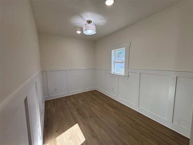 spare room featuring dark wood-type flooring