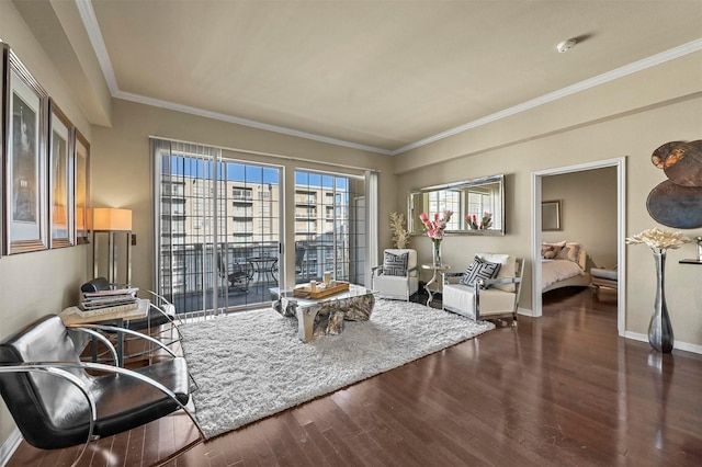 living area with ornamental molding and dark hardwood / wood-style floors