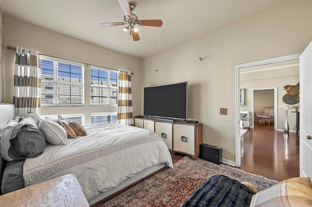 bedroom featuring ceiling fan and dark hardwood / wood-style flooring