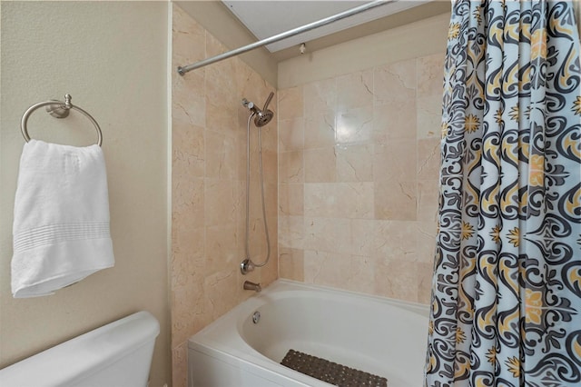 bathroom with shower / bath combo with shower curtain and toilet