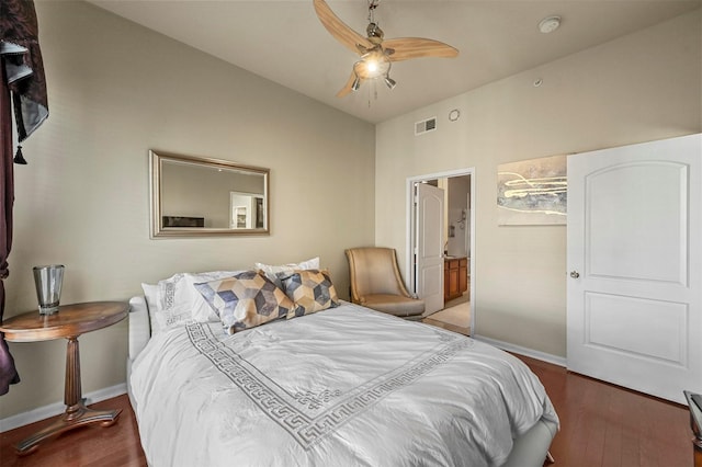 bedroom featuring ceiling fan, connected bathroom, and wood-type flooring