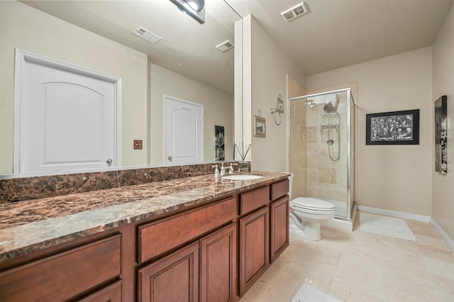 bathroom featuring toilet, walk in shower, and vanity