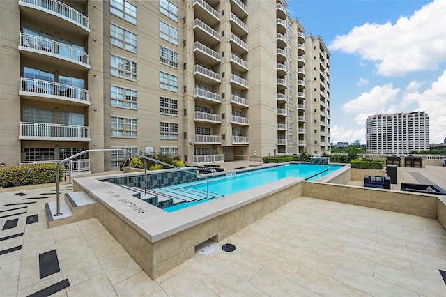 view of pool featuring a patio