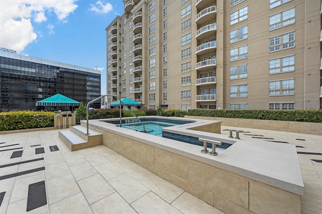 view of swimming pool with a patio area