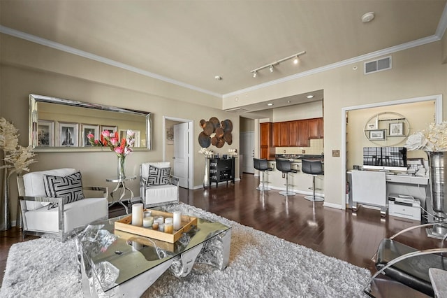 living room featuring rail lighting, ornamental molding, and dark hardwood / wood-style flooring