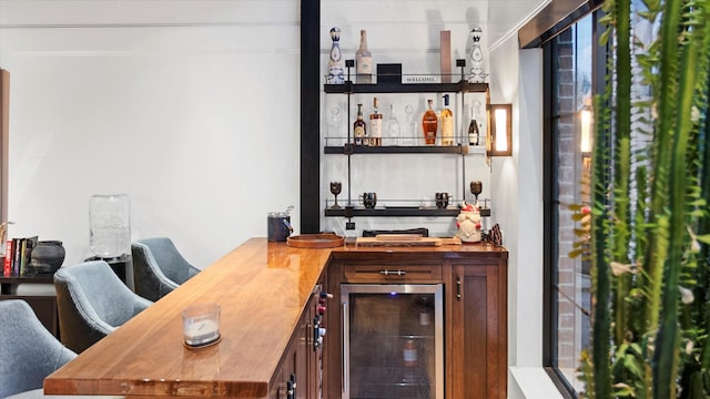 bar featuring wine cooler and butcher block countertops