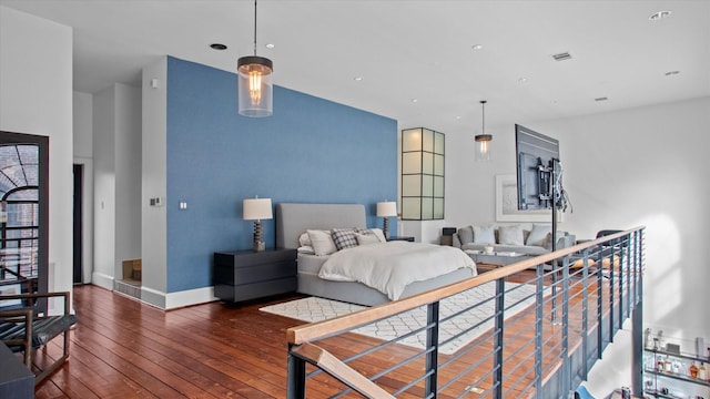 bedroom with dark wood-type flooring