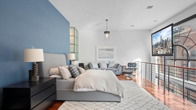 bedroom featuring hardwood / wood-style flooring