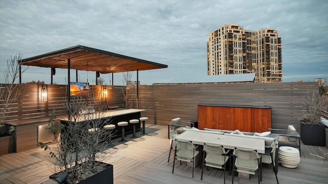 wooden deck with an outdoor bar