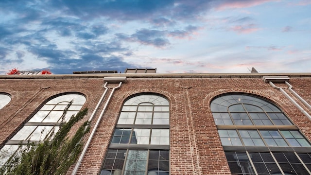 view of outdoor building at dusk