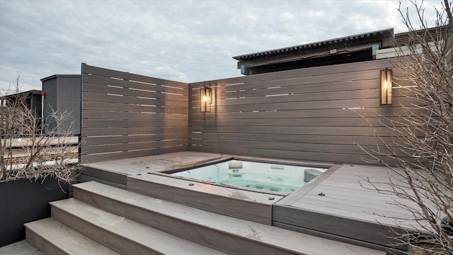 exterior space with a hot tub