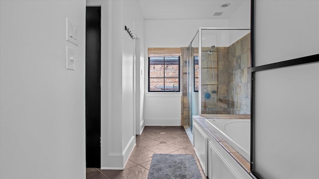 bathroom featuring shower with separate bathtub and tile patterned floors