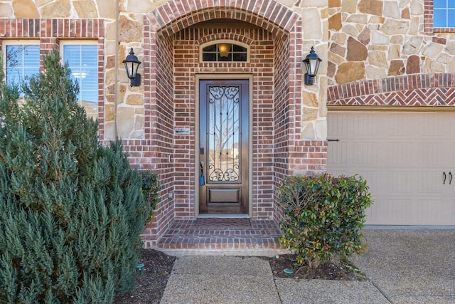 doorway to property featuring a garage