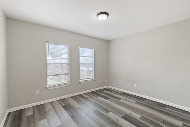 spare room with wood-type flooring