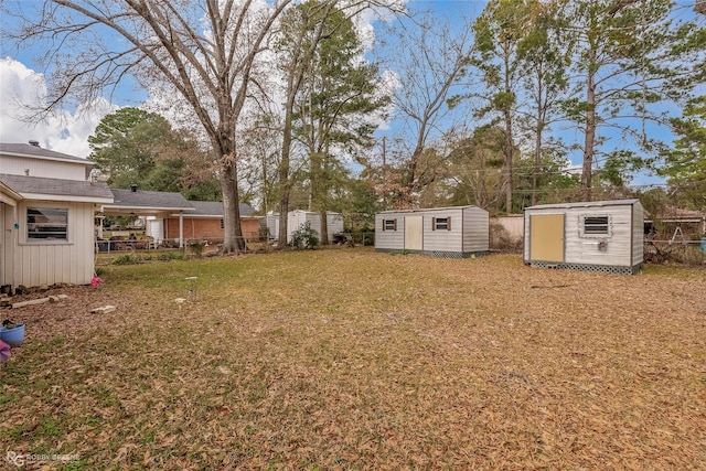 view of yard with a storage unit