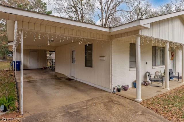 view of property exterior with a carport