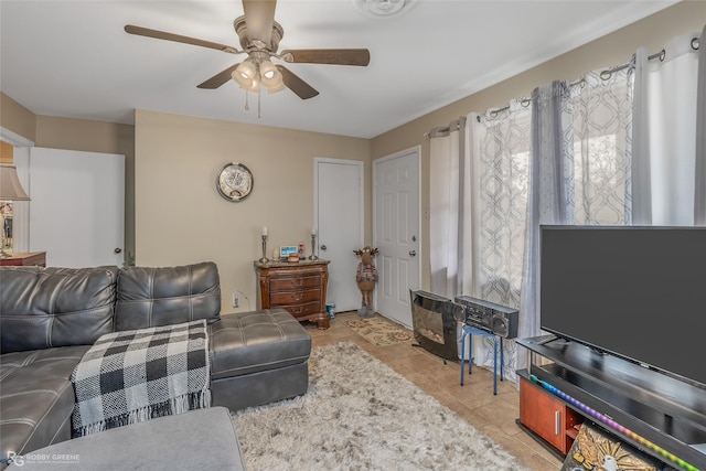 tiled living room featuring ceiling fan