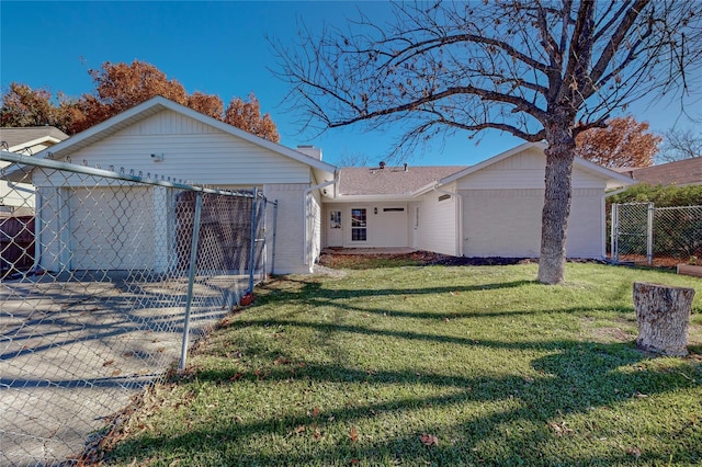 ranch-style home featuring a front yard