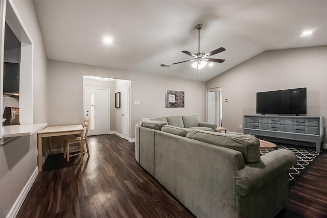 living room with ceiling fan, lofted ceiling, and dark hardwood / wood-style flooring