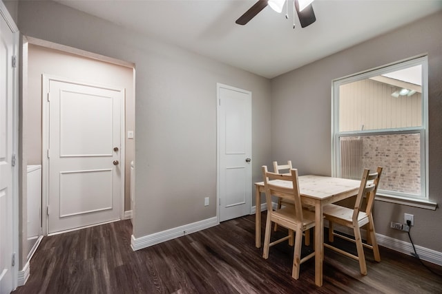 dining space with dark wood-type flooring and ceiling fan