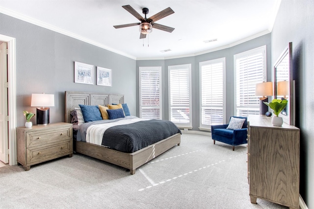 carpeted bedroom featuring ornamental molding and ceiling fan