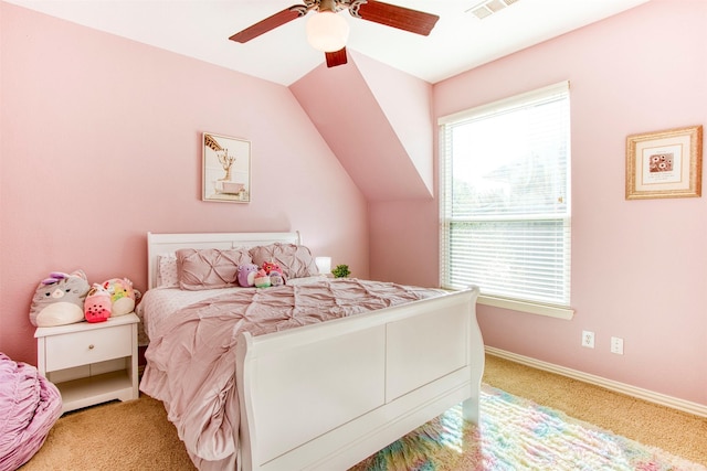 bedroom featuring ceiling fan, lofted ceiling, and light carpet