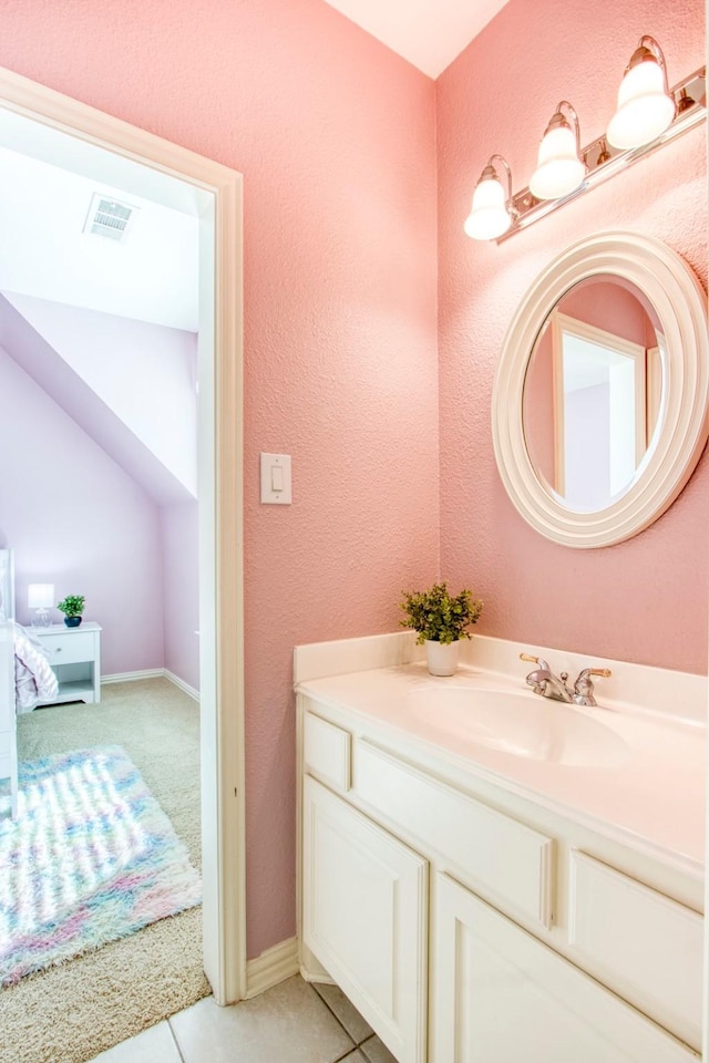 bathroom with vanity and tile patterned flooring