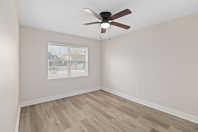 spare room featuring ceiling fan and light hardwood / wood-style flooring