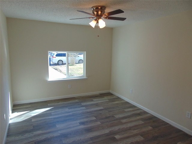 spare room featuring ceiling fan, dark hardwood / wood-style floors, and a textured ceiling