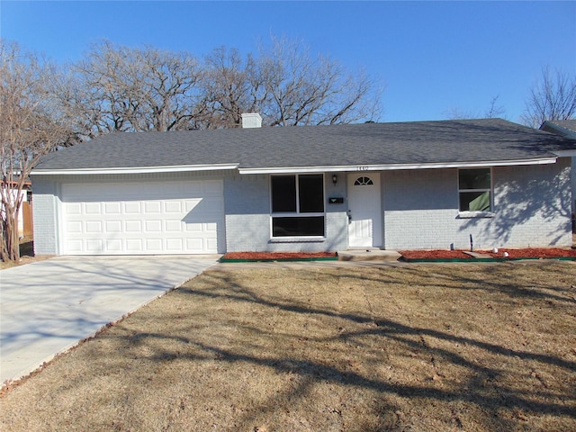 single story home featuring a garage and a front yard