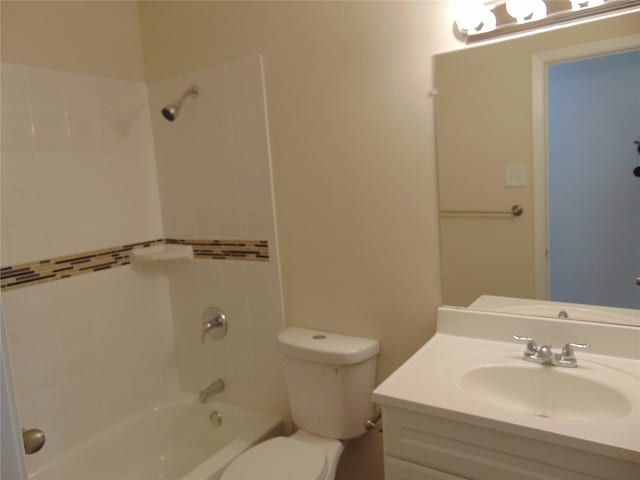 full bathroom featuring vanity, toilet, and tiled shower / bath combo