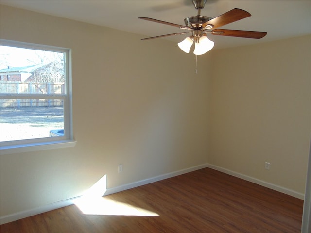 unfurnished room featuring dark hardwood / wood-style floors and plenty of natural light