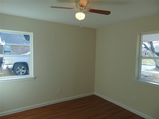 empty room with dark hardwood / wood-style flooring