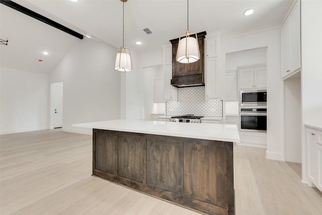 kitchen with built in microwave, hanging light fixtures, tasteful backsplash, oven, and a center island