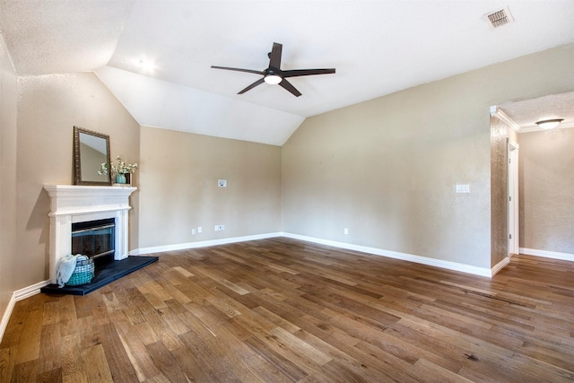 unfurnished living room with vaulted ceiling, ceiling fan, and wood-type flooring