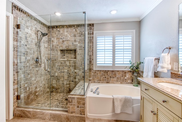 bathroom featuring vanity, shower with separate bathtub, and crown molding