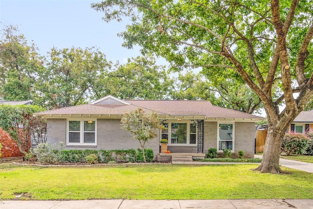 ranch-style home with a front yard