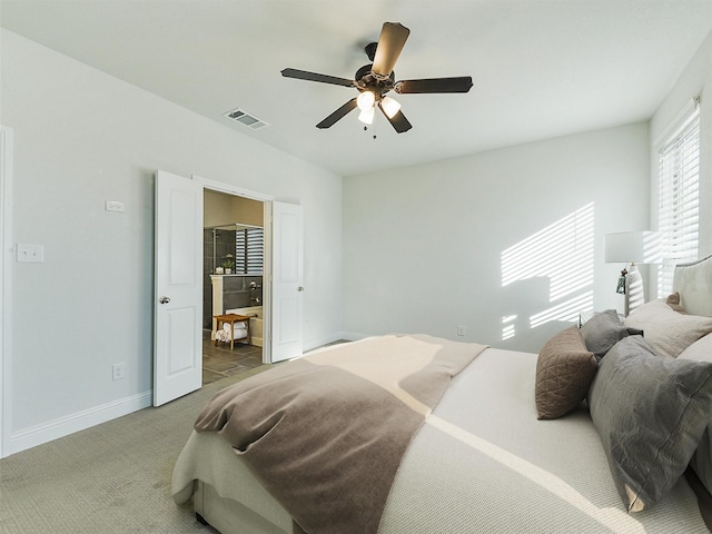 bedroom featuring ceiling fan and light colored carpet