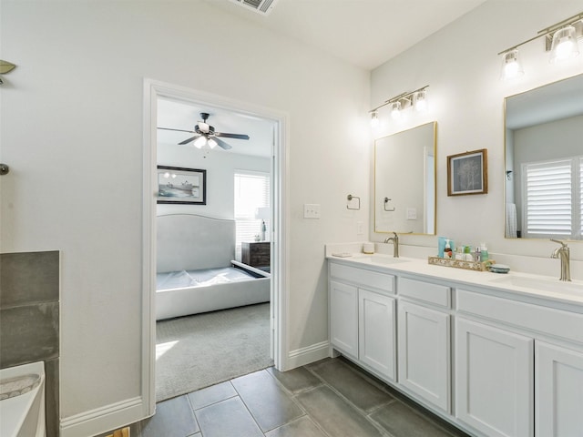 bathroom featuring ceiling fan, tile patterned floors, and vanity