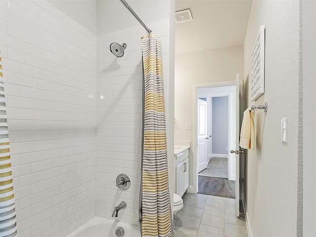 full bathroom featuring toilet, tile patterned floors, shower / bathtub combination with curtain, and vanity